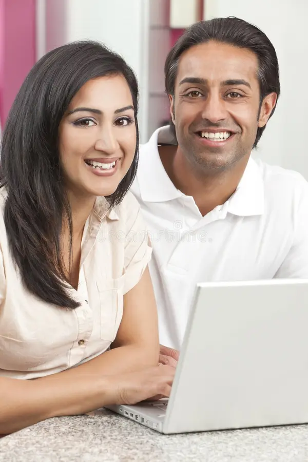 asian indian man woman couple using laptop 21929182